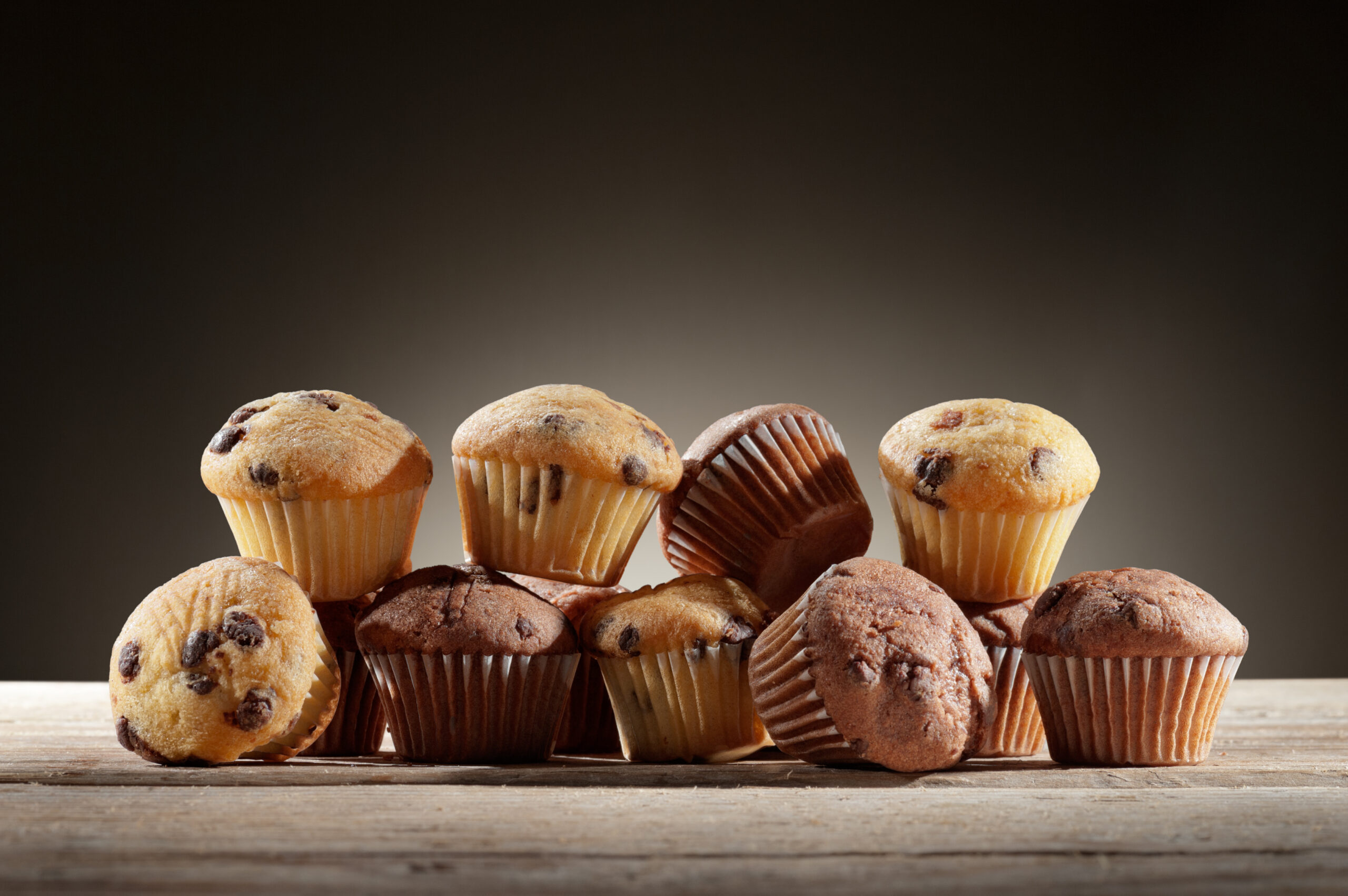 a variety of little muffin on wooden table